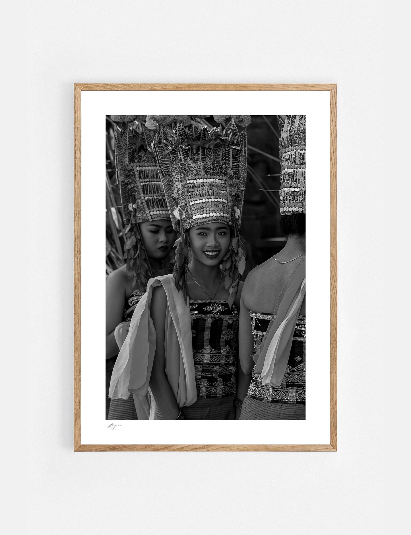 Young Balinese woman performing the sacred Rejang Dance during a temple ceremony in Bali, photographed in black and white.