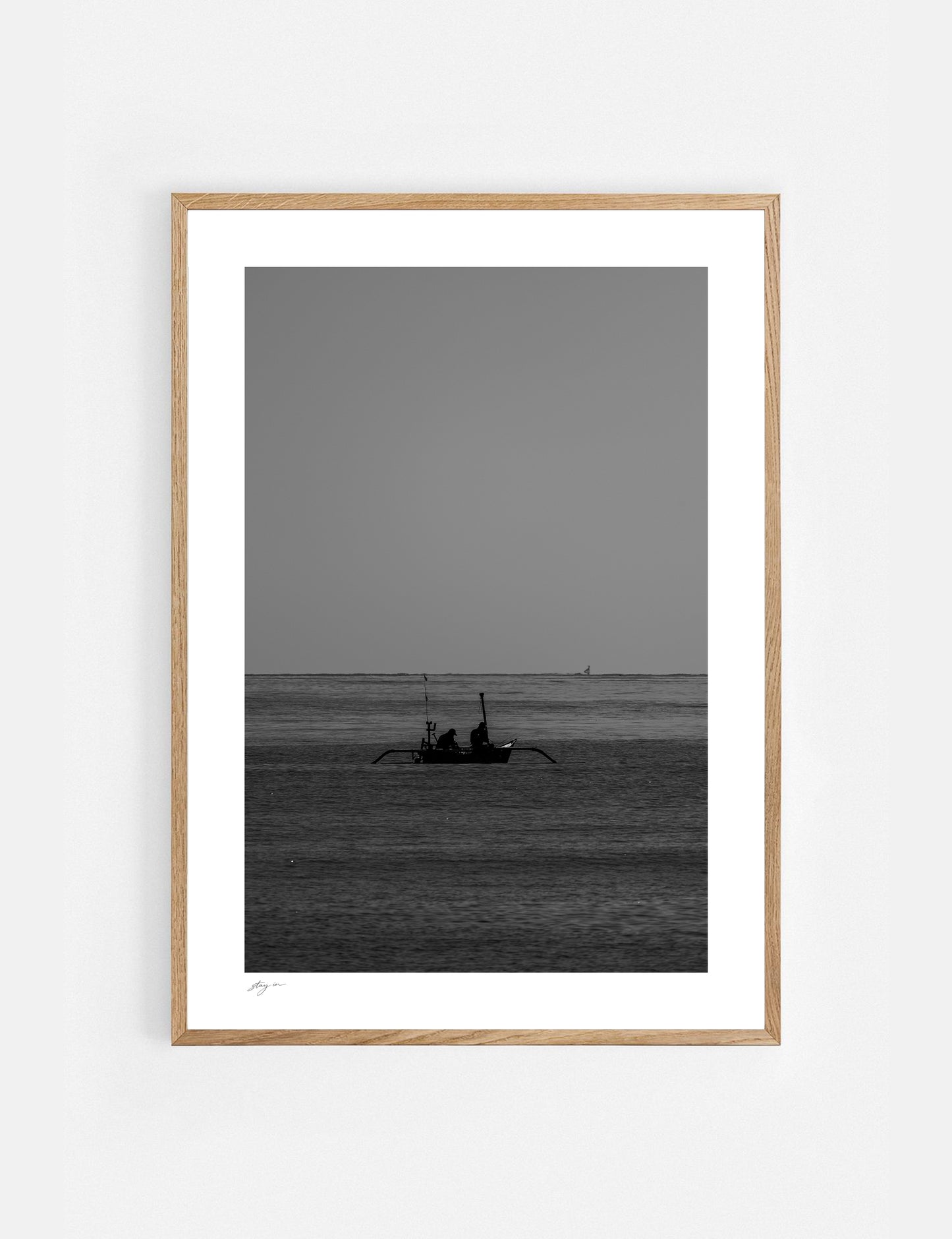 Black and white art print of a traditional fishing boat on the coast of Bali.