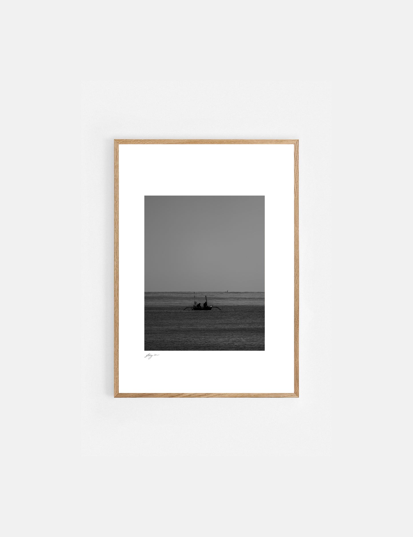 Black and white art print of a traditional fishing boat on the coast of Bali.
