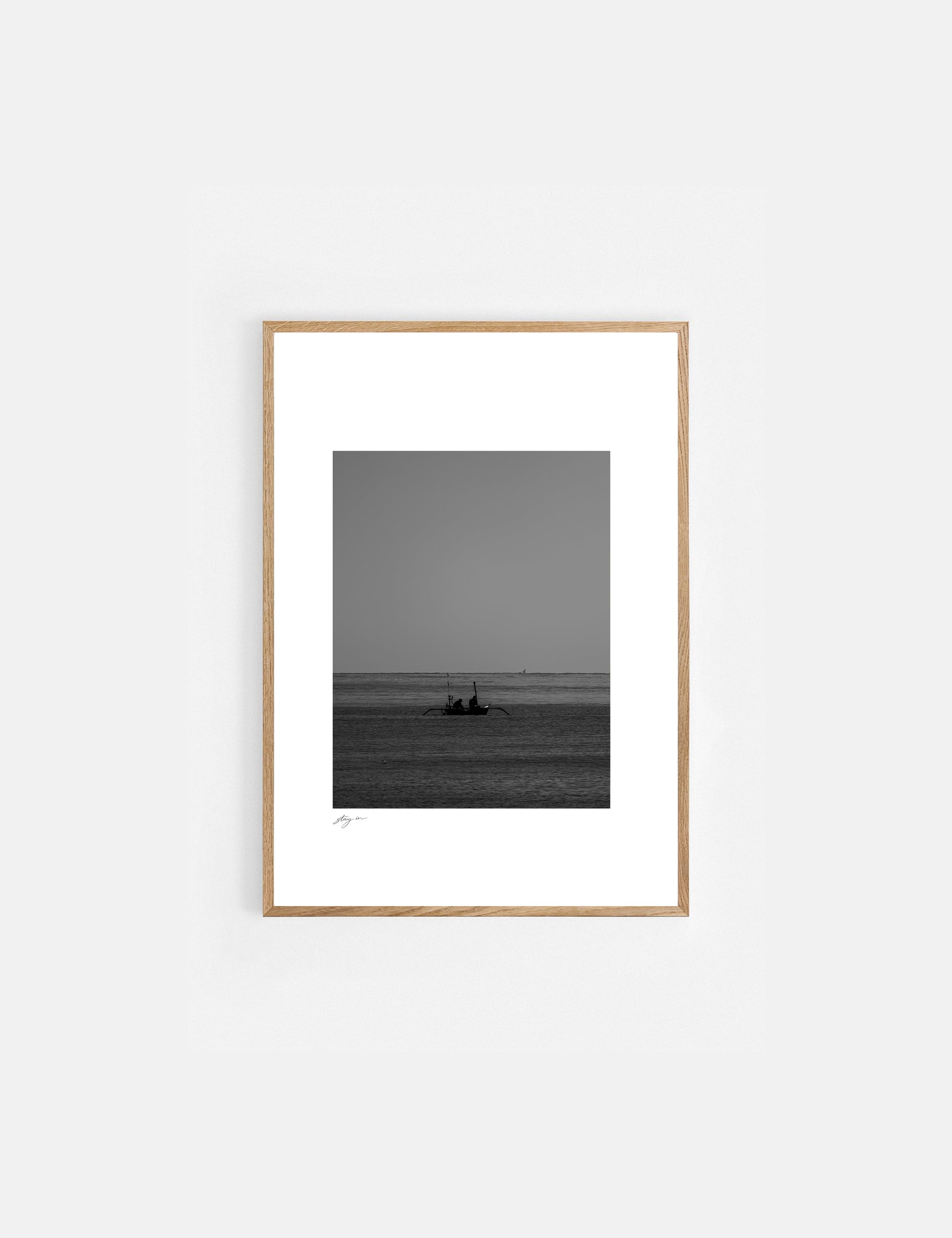 Black and white art print of a traditional fishing boat on the coast of Bali.