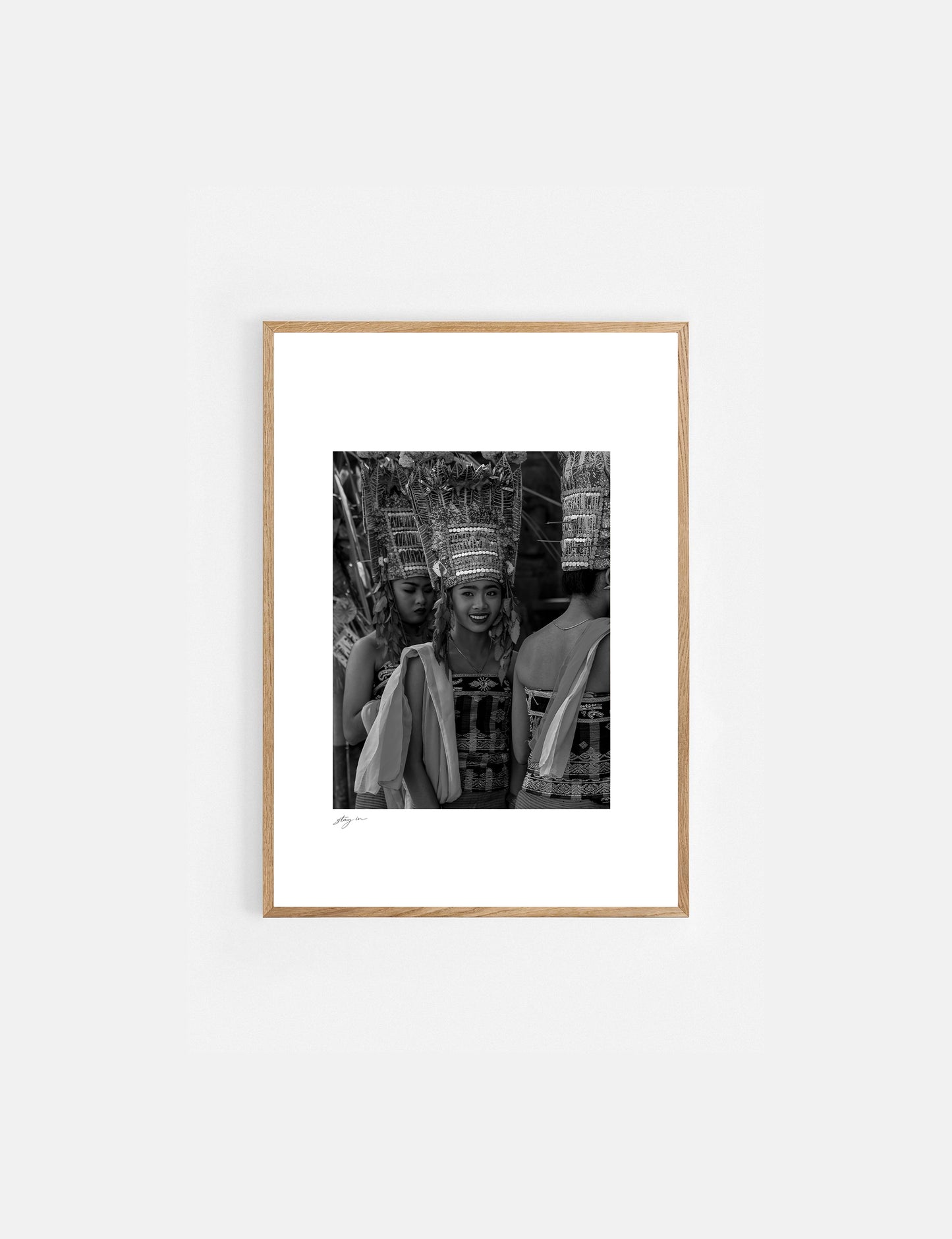 Young Balinese woman performing the sacred Rejang Dance during a temple ceremony in Bali, photographed in black and white.