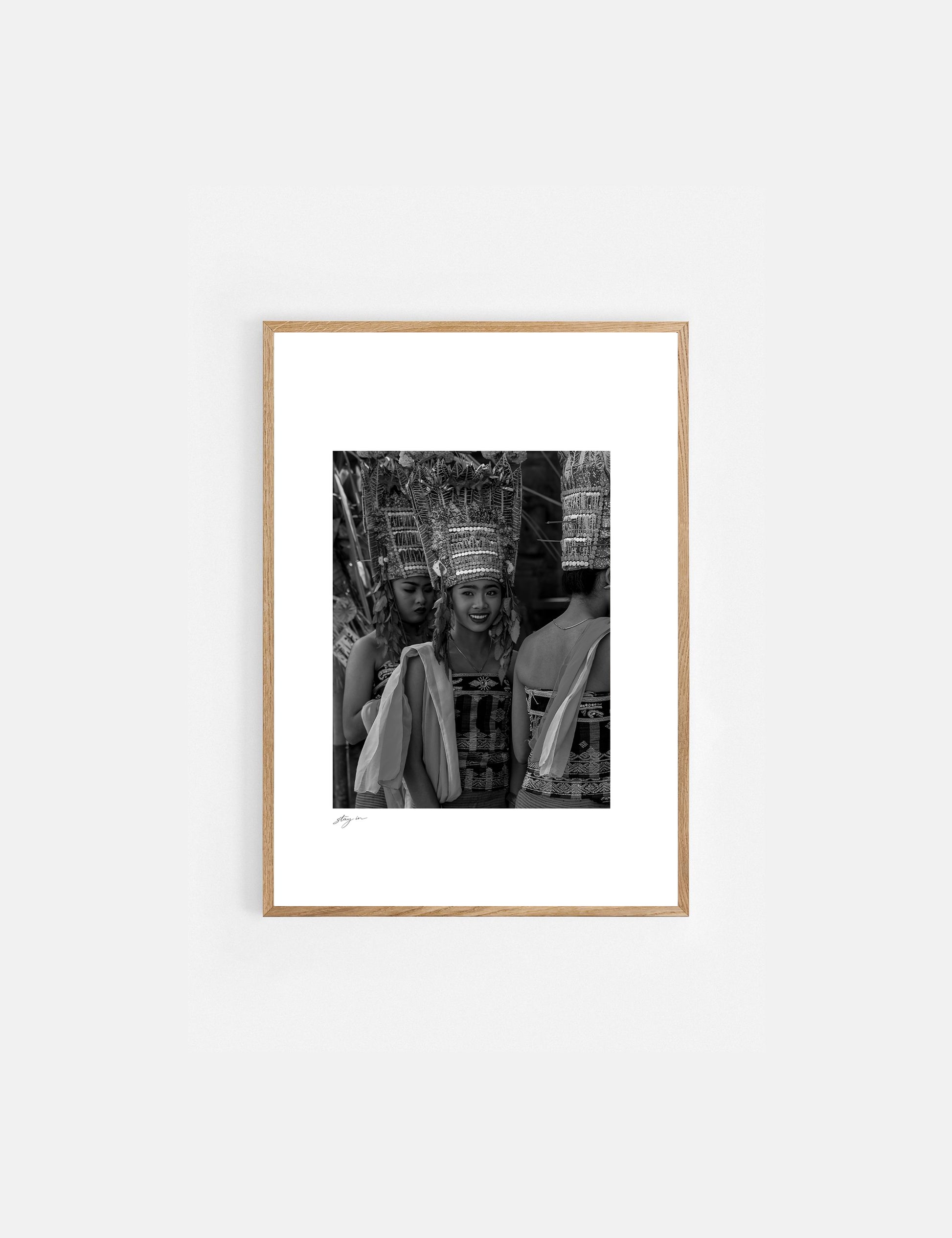 Young Balinese woman performing the sacred Rejang Dance during a temple ceremony in Bali, photographed in black and white.