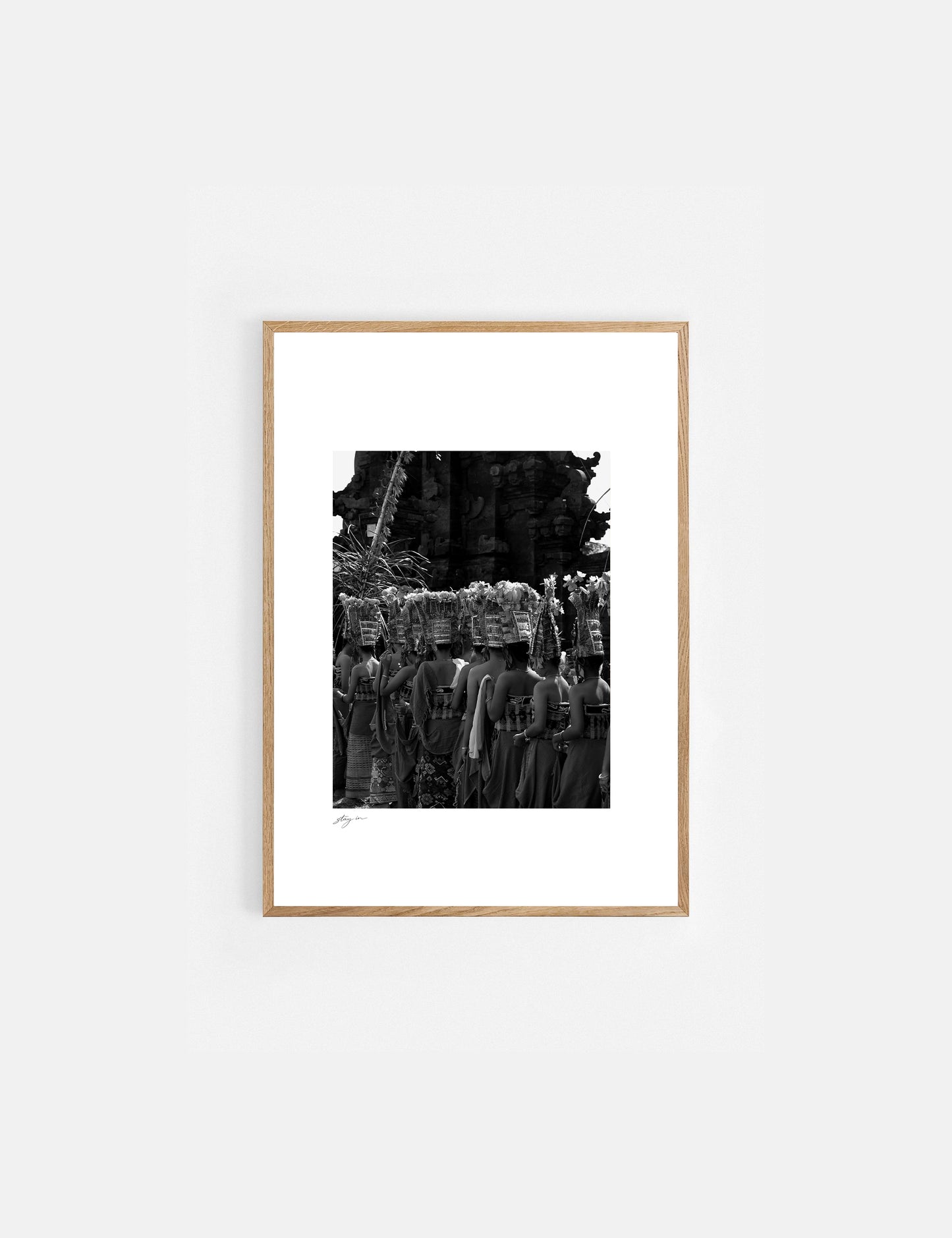 Balinese dancers performing the sacred Rejang Dance during a traditional temple ceremony in Bali, photographed in black and white.