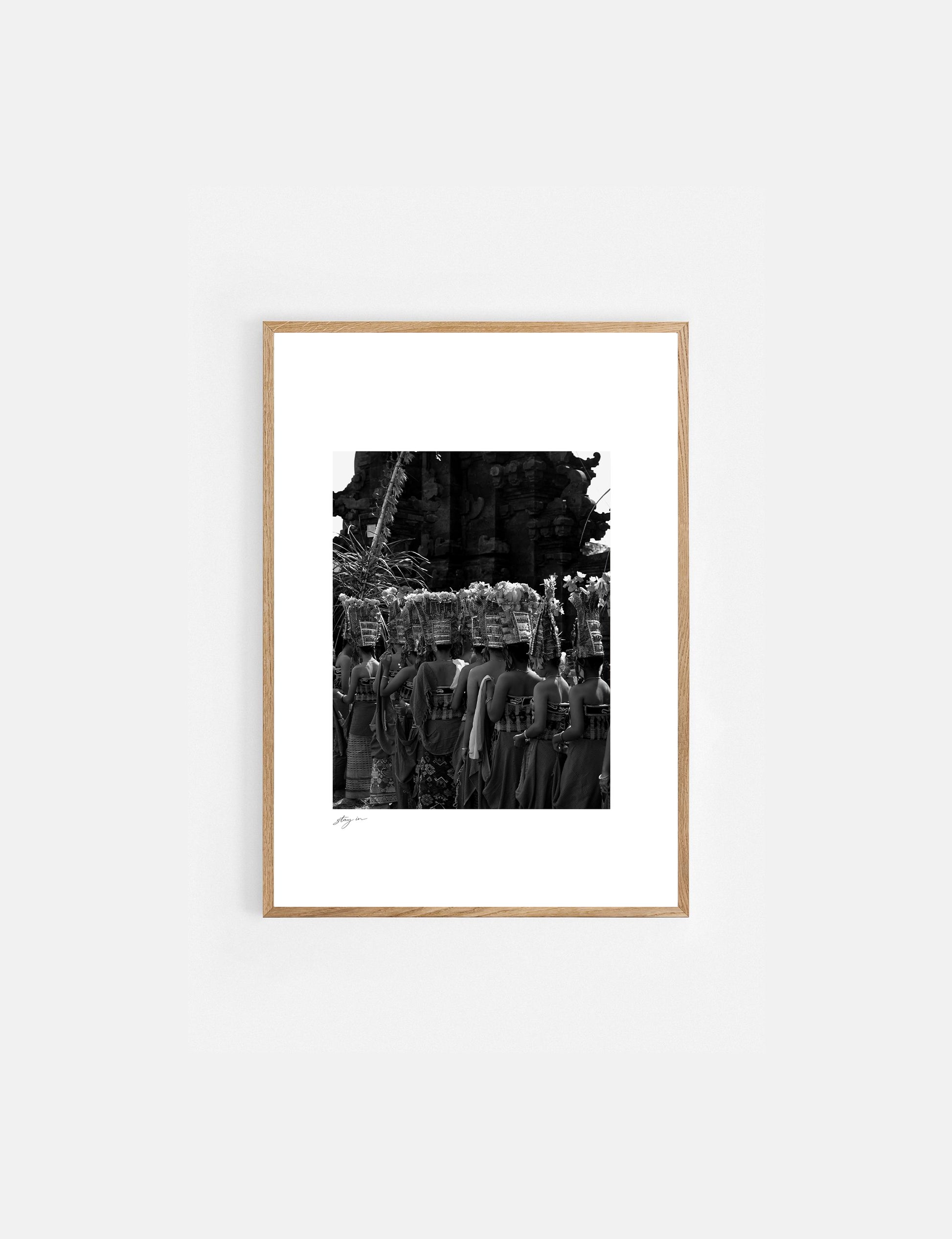 Balinese dancers performing the sacred Rejang Dance during a traditional temple ceremony in Bali, photographed in black and white.