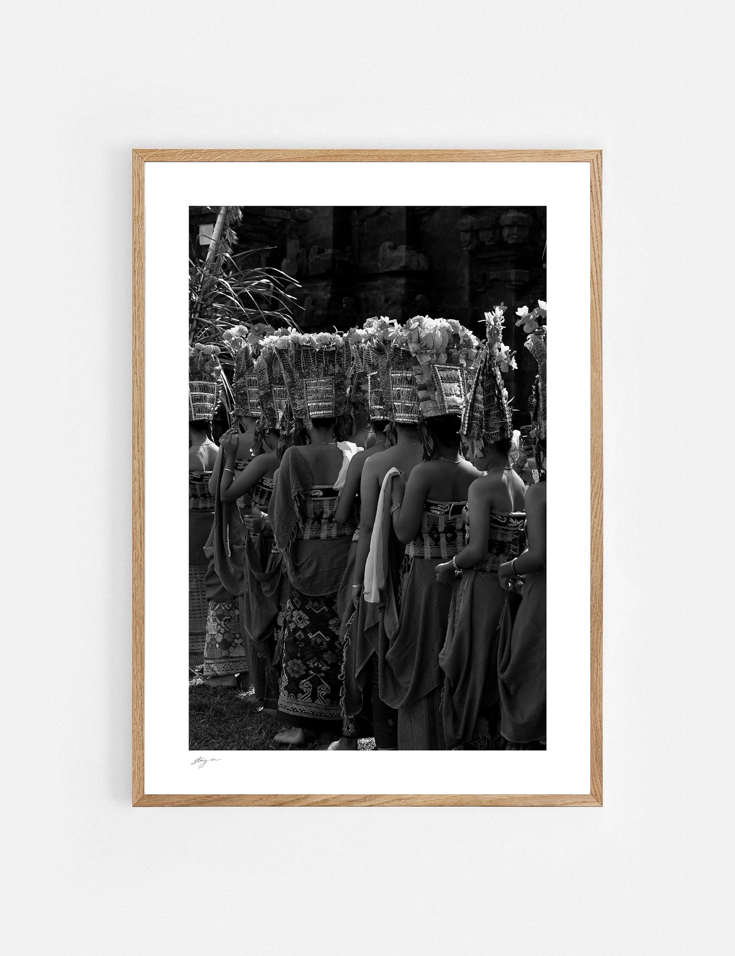 Balinese dancers performing the sacred Rejang Dance during a traditional temple ceremony in Bali, photographed in black and white.